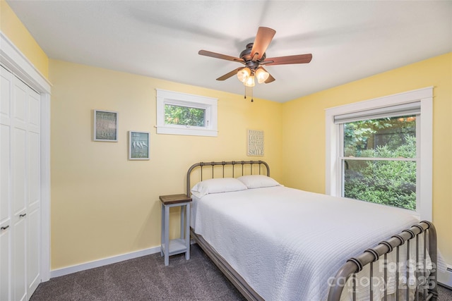 477 Locust Dr, Maggie Valley, NC 28751 - carpeted bedroom with multiple windows, a ceiling fan, and a closet