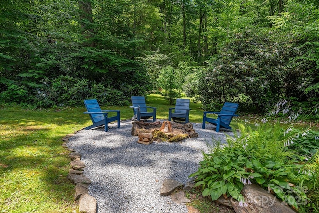 477 Locust Dr, Maggie Valley, NC 28751 - view of patio featuring a fire pit