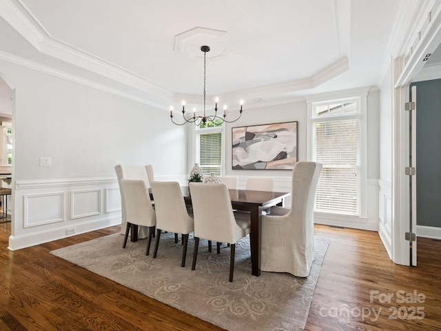 2103 Lytton Ln, Matthews, NC 28104 - dining room with a tray ceiling, a chandelier, crown molding, healthy amount of natural light, and arched walkways