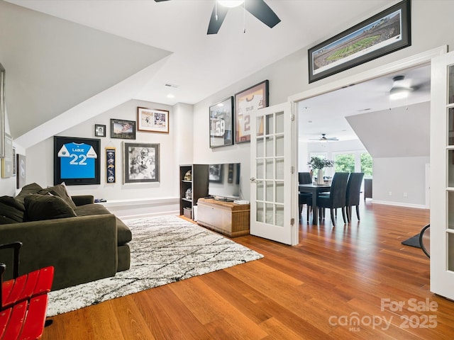 2103 Lytton Ln, Matthews, NC 28104 - living area with ceiling fan, wood finished floors, french doors, and vaulted ceiling