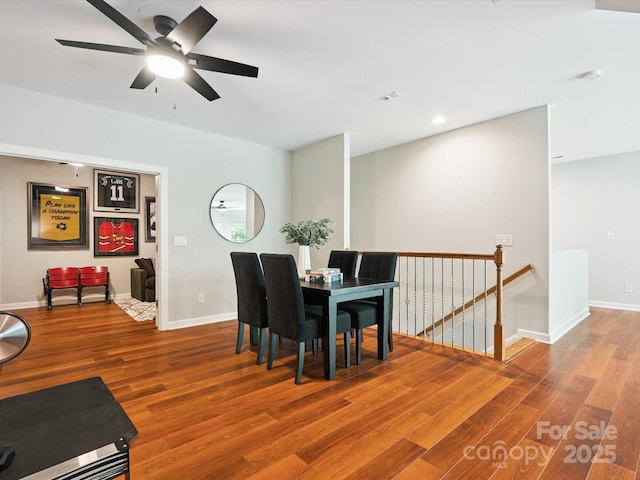 2103 Lytton Ln, Matthews, NC 28104 - dining area with wood finished floors, a ceiling fan, and recessed lighting