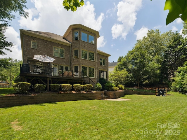 2103 Lytton Ln, Matthews, NC 28104 - back of house with a deck, a lawn, and brick siding
