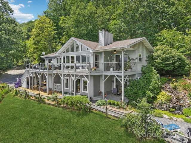 600 Summit Rdg Unit 34, Waynesville, NC 28786 - rear view of property with a deck, a chimney, a lawn, and a ceiling fan