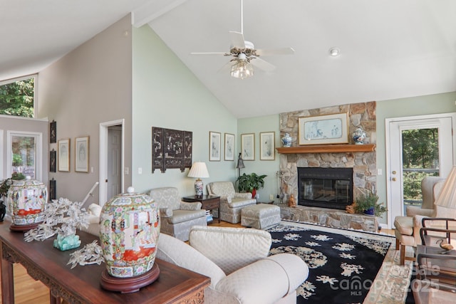 600 Summit Rdg Unit 34, Waynesville, NC 28786 - living room with high vaulted ceiling, plenty of natural light, a stone fireplace, a ceiling fan, and wood finished floors