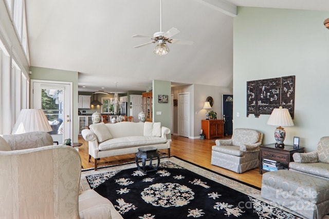 600 Summit Rdg Unit 34, Waynesville, NC 28786 - living room with wood finished floors, high vaulted ceiling, a ceiling fan, and beam ceiling