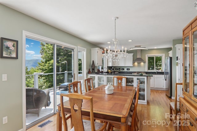600 Summit Rdg Unit 34, Waynesville, NC 28786 - dining space with a chandelier, plenty of natural light, light wood finished floors, and recessed lighting