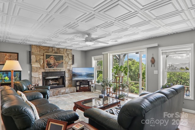 600 Summit Rdg Unit 34, Waynesville, NC 28786 - living area featuring ceiling fan, healthy amount of natural light, a fireplace, and an ornate ceiling