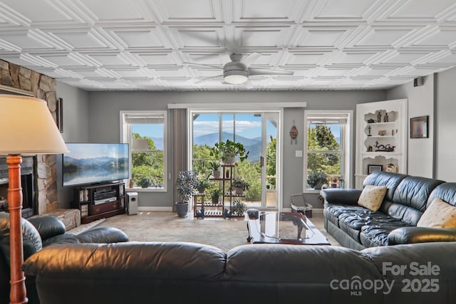 600 Summit Rdg Unit 34, Waynesville, NC 28786 - living area with a fireplace, ceiling fan, and an ornate ceiling