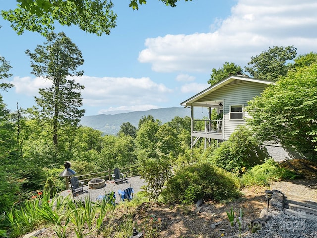 600 Summit Rdg Unit 34, Waynesville, NC 28786 - view of yard featuring a fire pit, a mountain view, and a balcony