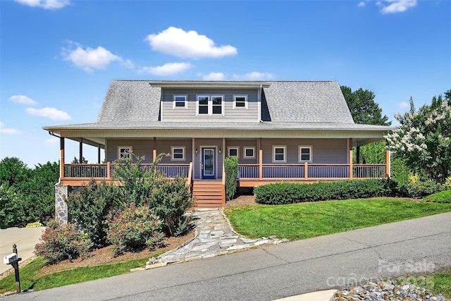 4 Stars Forever Dr, Black Mountain, NC 28711 - country-style home with covered porch, a front yard, and a shingled roof