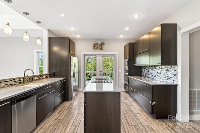 4 Stars Forever Dr, Black Mountain, NC 28711 - kitchen featuring stainless steel appliances, a kitchen island, wood tiled floors, recessed lighting, and decorative backsplash