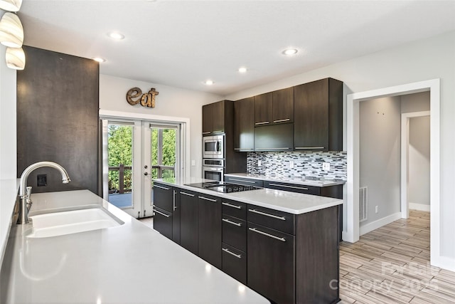 4 Stars Forever Dr, Black Mountain, NC 28711 - kitchen with appliances with stainless steel finishes, light countertops, backsplash, french doors, and dark brown cabinets