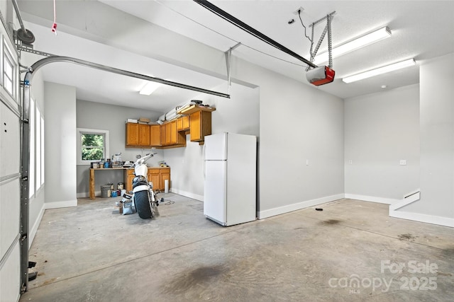 4 Stars Forever Dr, Black Mountain, NC 28711 - garage featuring freestanding refrigerator and a garage door opener