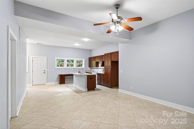 4 Stars Forever Dr, Black Mountain, NC 28711 - kitchen with light tile patterned floors, a kitchen island with sink, and ceiling fan