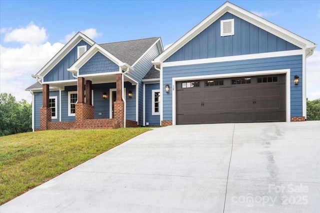 18 Morningside Dr, Granite Falls, NC 28630 - view of front of property with board and batten siding, a garage, a front lawn, and a porch