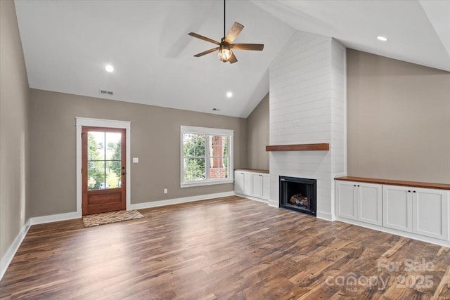 18 Morningside Dr, Granite Falls, NC 28630 - unfurnished living room with a ceiling fan, plenty of natural light, wood finished floors, a fireplace, and high vaulted ceiling