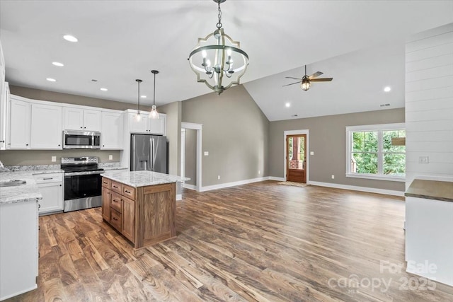 18 Morningside Dr, Granite Falls, NC 28630 - kitchen with appliances with stainless steel finishes, a ceiling fan, a chandelier, wood finished floors, and open floor plan