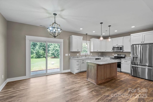 18 Morningside Dr, Granite Falls, NC 28630 - kitchen with stainless steel appliances, recessed lighting, white cabinetry, dark wood-type flooring, and a chandelier