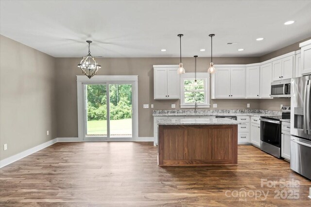 18 Morningside Dr, Granite Falls, NC 28630 - kitchen with stainless steel appliances, plenty of natural light, a kitchen island, wood finished floors, and recessed lighting