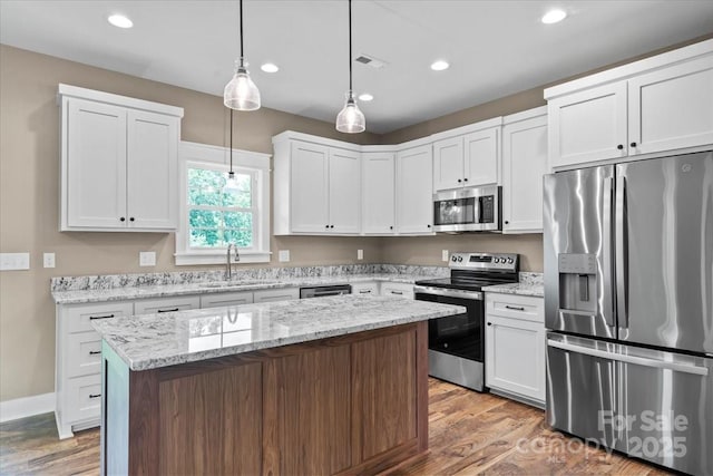 18 Morningside Dr, Granite Falls, NC 28630 - kitchen with stainless steel appliances, recessed lighting, wood finished floors, a center island, and hanging light fixtures