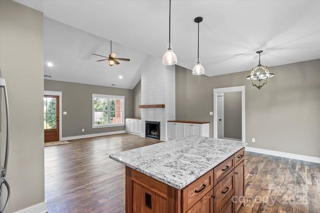 18 Morningside Dr, Granite Falls, NC 28630 - kitchen featuring a ceiling fan, dark wood-type flooring, hanging light fixtures, brown cabinetry, and high vaulted ceiling