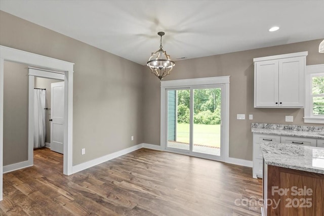 18 Morningside Dr, Granite Falls, NC 28630 - unfurnished dining area with a chandelier, wood finished floors, healthy amount of natural light, and recessed lighting