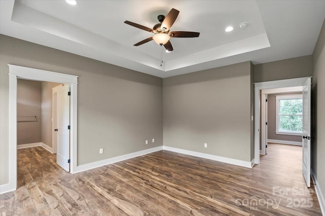 18 Morningside Dr, Granite Falls, NC 28630 - spare room featuring a tray ceiling, wood finished floors, a smoke detector, ceiling fan, and recessed lighting