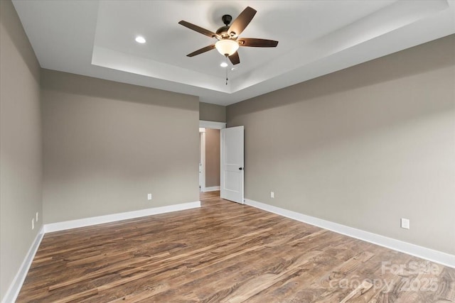 18 Morningside Dr, Granite Falls, NC 28630 - unfurnished room with wood finished floors, a tray ceiling, recessed lighting, and a ceiling fan