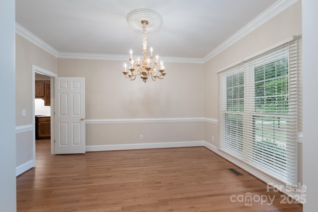 1503 Jack White Dr, Rock Hill, SC 29732 - empty room with a chandelier, crown molding, and light wood-style flooring