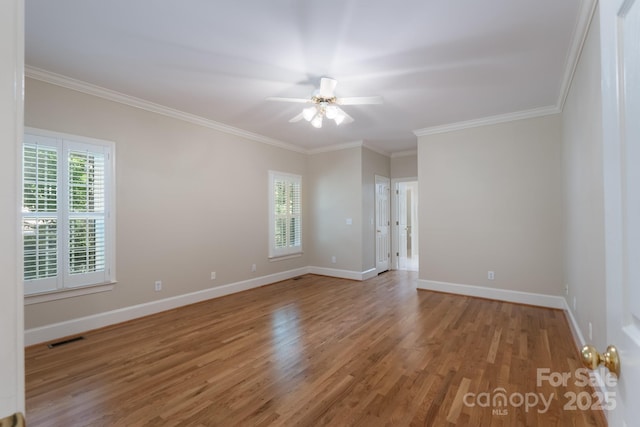 1503 Jack White Dr, Rock Hill, SC 29732 - spare room featuring healthy amount of natural light, wood finished floors, a ceiling fan, and crown molding