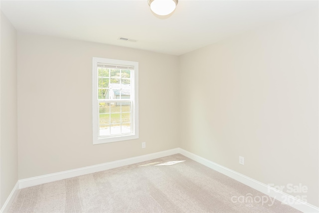 671 Sylvan St SW, Concord, NC 28025 - unfurnished room with baseboards and light carpet