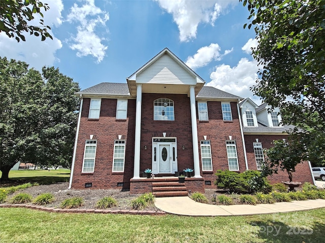 509 E Main St, Rockwell, NC 28138 - neoclassical home featuring a front lawn, brick siding, and crawl space