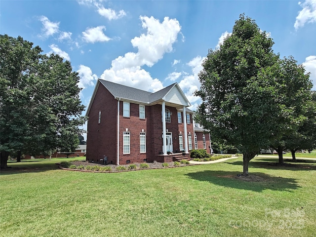 509 E Main St, Rockwell, NC 28138 - view of front facade with brick siding, a front yard, and crawl space