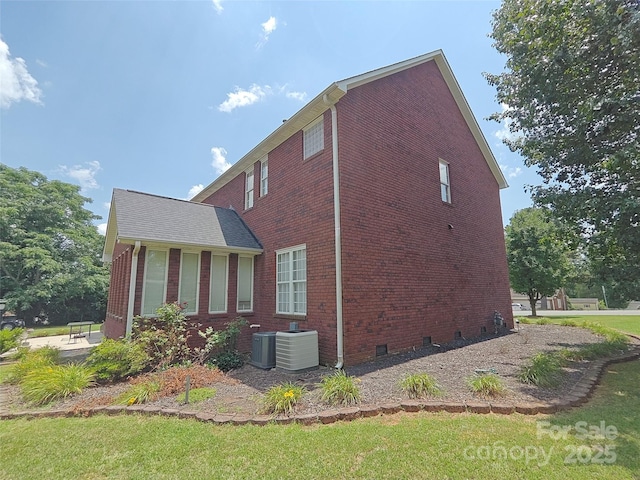 509 E Main St, Rockwell, NC 28138 - view of side of home featuring brick siding, a yard, and a patio