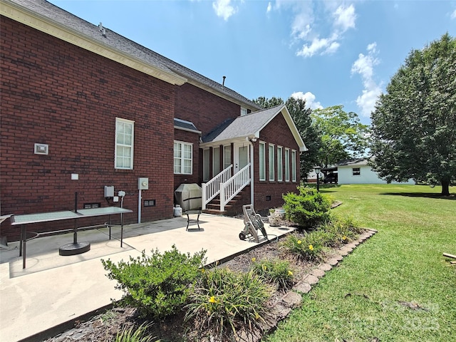 509 E Main St, Rockwell, NC 28138 - view of side of property with brick siding, a lawn, and a patio area