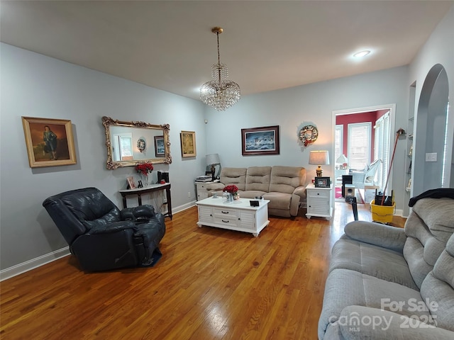 509 E Main St, Rockwell, NC 28138 - living room with wood finished floors, arched walkways, and a chandelier