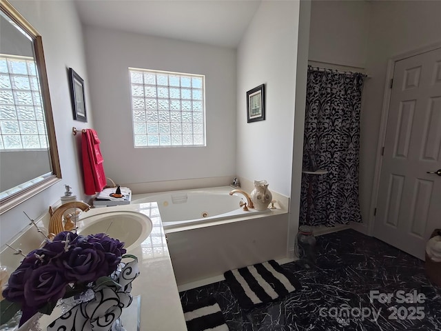 509 E Main St, Rockwell, NC 28138 - bathroom featuring marble look tile flooring, a tub with jets, and vanity