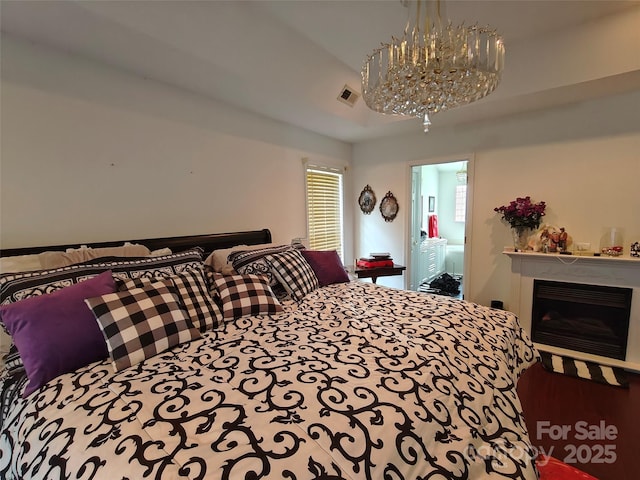 509 E Main St, Rockwell, NC 28138 - bedroom featuring a chandelier and a fireplace