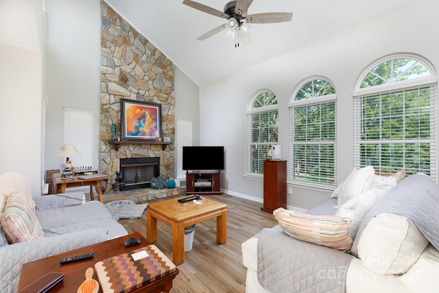 2949 Glenstone Dr, Rock Hill, SC 29730 - living area featuring a ceiling fan, light wood-type flooring, high vaulted ceiling, and a stone fireplace