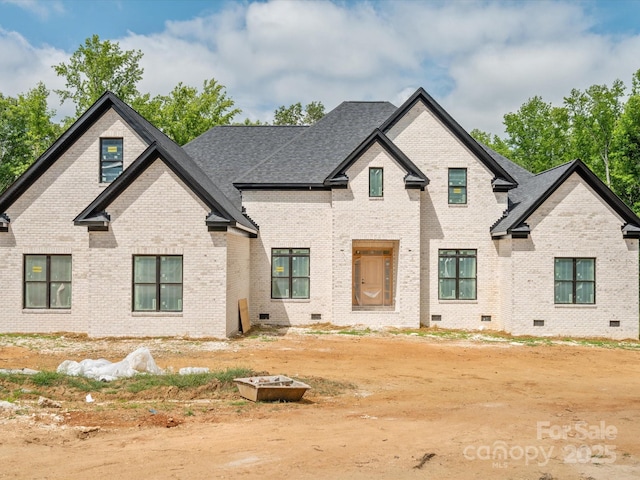 8018 Fairmont Dr, Waxhaw, NC 28173 - french country home with crawl space, brick siding, and a shingled roof