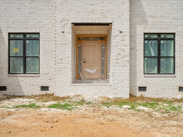 8018 Fairmont Dr, Waxhaw, NC 28173 - doorway to property with crawl space and brick siding