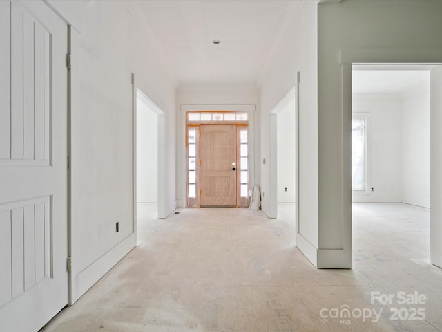 8018 Fairmont Dr, Waxhaw, NC 28173 - foyer entrance with crown molding, plenty of natural light, and unfinished concrete flooring