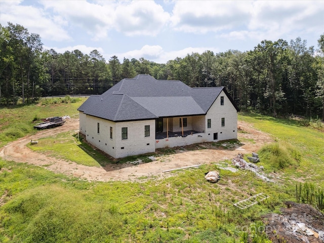 8018 Fairmont Dr, Waxhaw, NC 28173 - rear view of property with a view of trees, a lawn, and a shingled roof