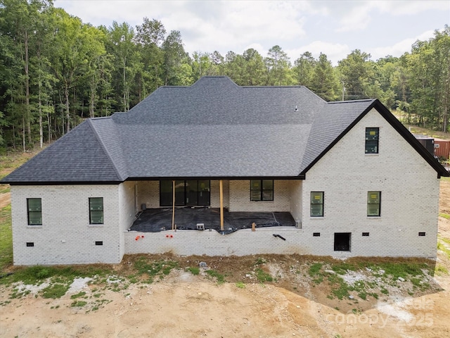 8018 Fairmont Dr, Waxhaw, NC 28173 - rear view of house with crawl space, brick siding, and roof with shingles