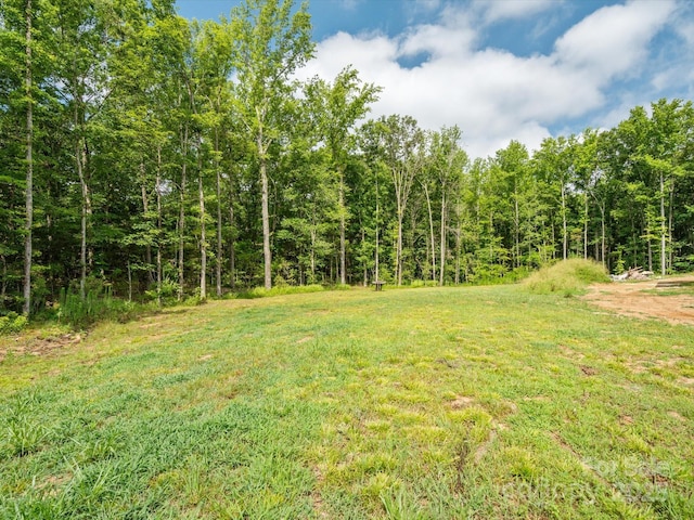 8018 Fairmont Dr, Waxhaw, NC 28173 - view of green lawn featuring a view of trees