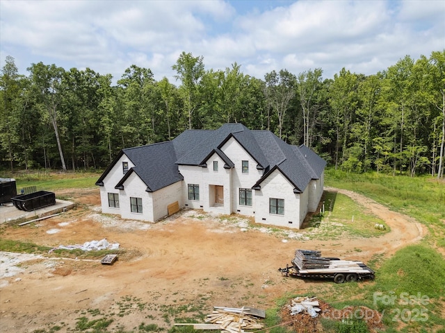 8018 Fairmont Dr, Waxhaw, NC 28173 - view of front of home with a shingled roof and a view of trees