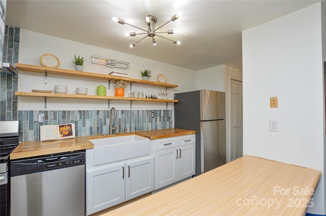 9325 Old Concord Rd Unit J, Charlotte, NC 28213 - kitchen with stainless steel appliances, butcher block countertops, tasteful backsplash, a chandelier, and open shelves