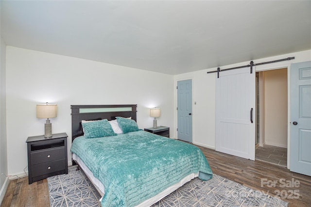 9325 Old Concord Rd Unit J, Charlotte, NC 28213 - bedroom featuring wood finished floors and a barn door