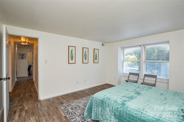 9325 Old Concord Rd Unit J, Charlotte, NC 28213 - bedroom with dark wood-type flooring and a chandelier