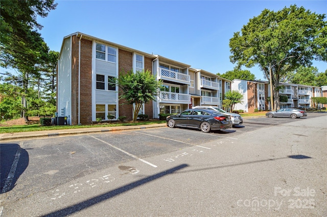 9325 Old Concord Rd Unit J, Charlotte, NC 28213 - view of apartment building / complex featuring uncovered parking